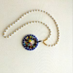 Glass multi-color pendant, beaded necklace. Unknown designer.
